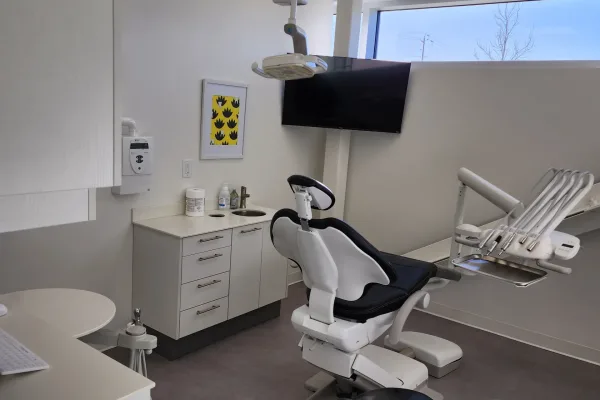 A clean, modern, and fully equipped private dental operatory room.