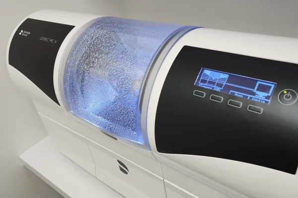Modern CEREC milling machine used to design and fabricate custom dental crowns in a single visit.